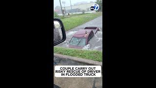 Risky Rescue! Couple Helps Houston Driver Stuck In Flooded Truck