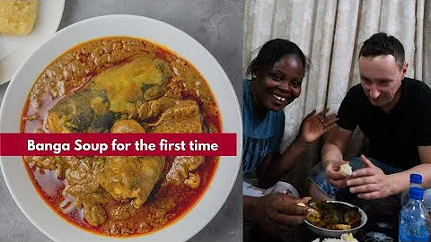 My husband trying banga soup with yam poundo for the first time in Nigeria