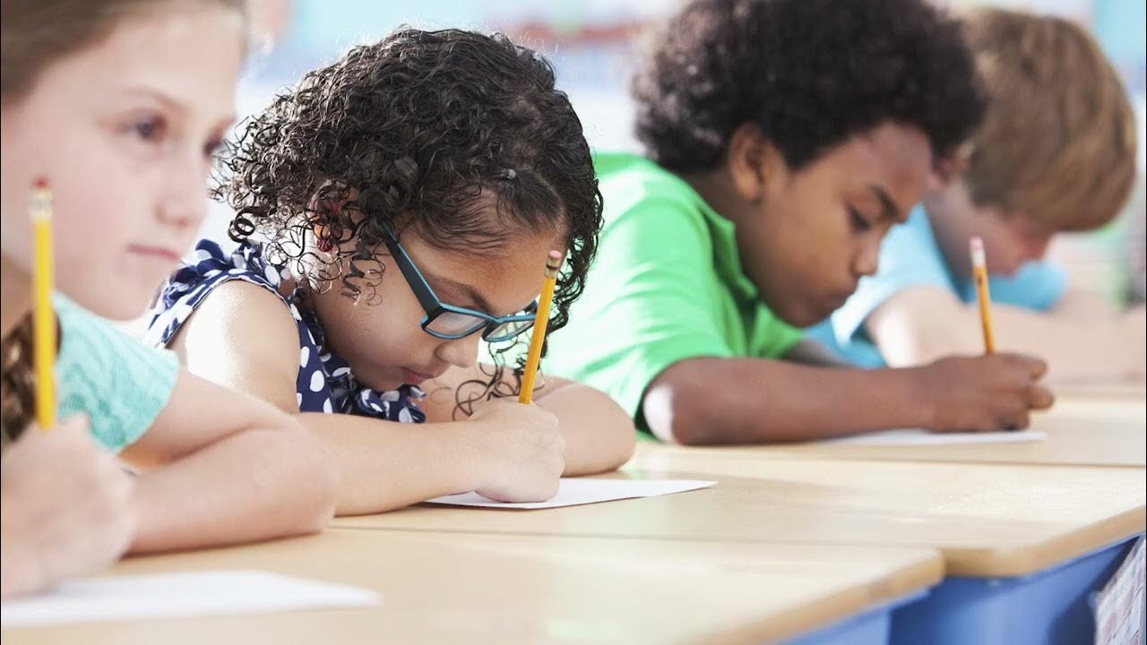When the students were writing. Человек за тетрадкой. They are pupils. Student пишет. Подросток пишет письмо.