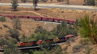 Pre merger power and colours , on a BNSF Manifest at Tehachapi Loop.