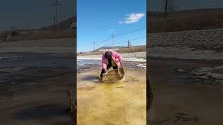 “Spring Farming Season: Breaking Ice to Catch Fish!”