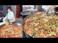 Chinese Cooked Free Meals for the elders on the Street in a Downtown Village