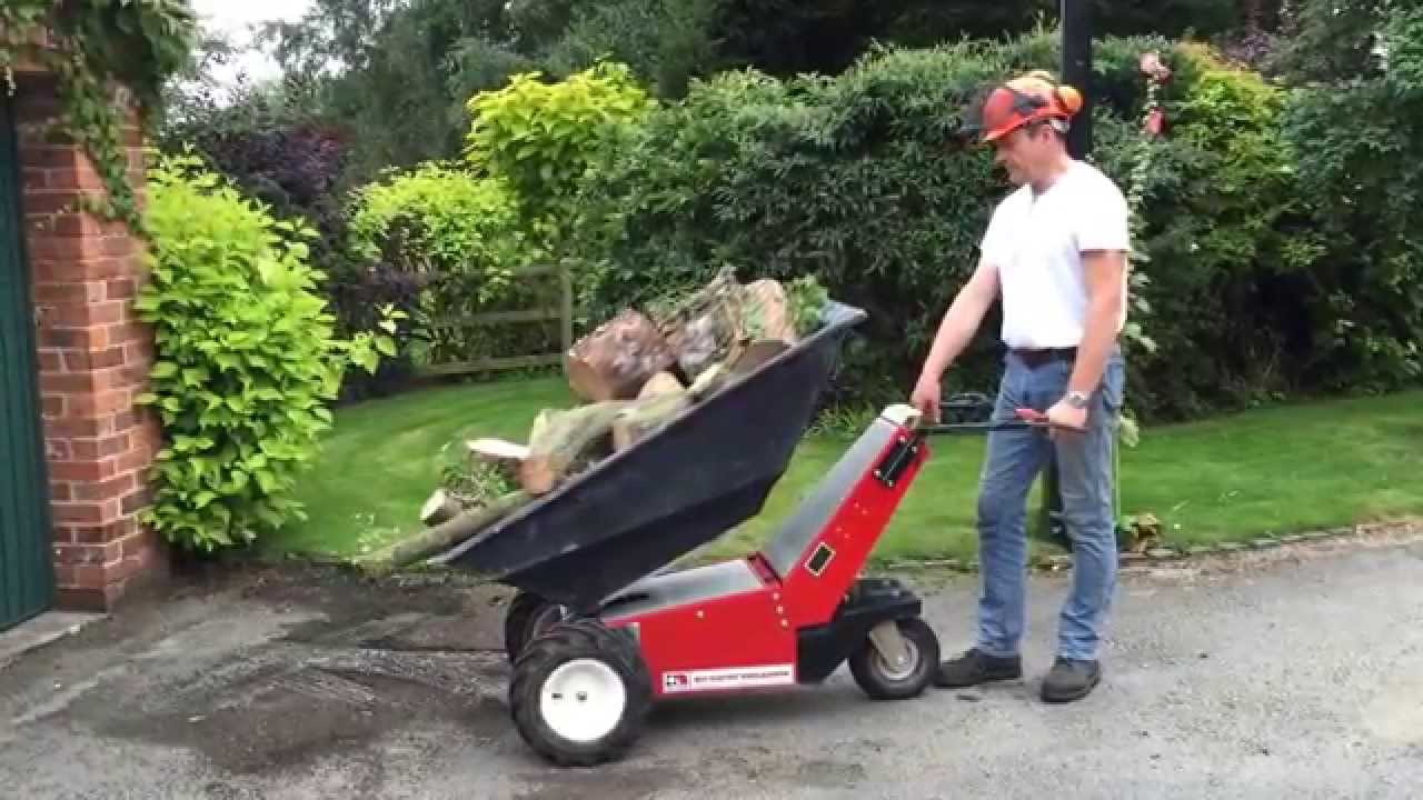 Electric Wheelbarrow delivering and tipping winter logs YouTube