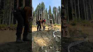 A bit of grunt work for a hose lay across the road