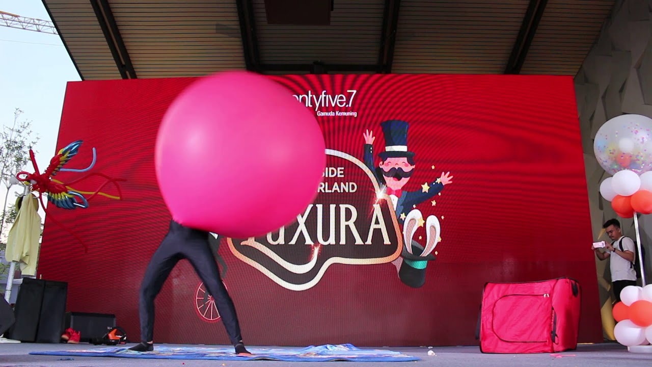 Human goes inside balloon.