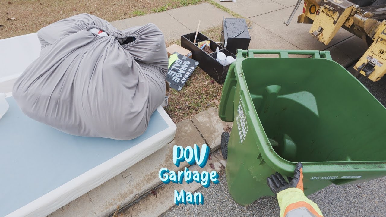 garbage-truck-rearloader-pov-cleaning-up-bulk-garbage-4k-full-uhd