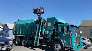 Two trucks collecting trash in San Pedro