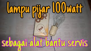 Lampu bohlam 100 watt sebagai alat bantu servis