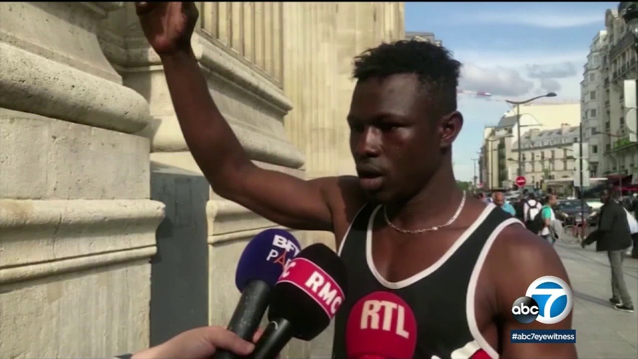 France: Macron rewards migrant hero who saved dangling child I ABC7