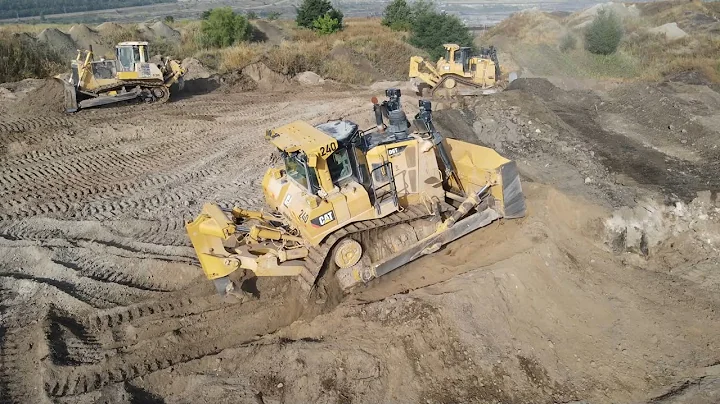 Two Caterpillar D9T Bulldozers And Komatsu D275AX Bulldozer Levelling A Huge Mining Site