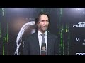 Keanu Reeves walks Toronto black carpet for Matrix sequel premiere