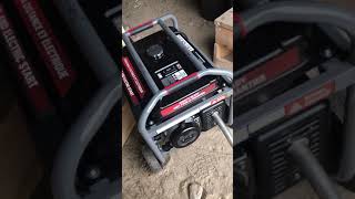 Installing an exhaust pipe on a Benchmark 11,500 Generator