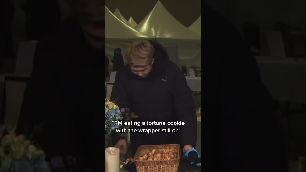 Rm eating a fortune cookie with the wrapper still on