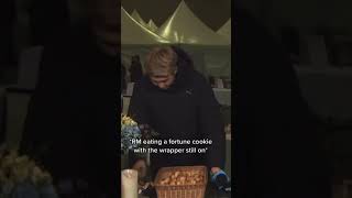 Rm eating a fortune cookie with the wrapper still on Rm eating a fortune cookie with the wrapper still on