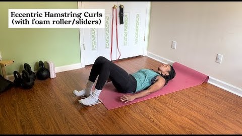 Eccentric Hamstring Curls with foam roller/sliders