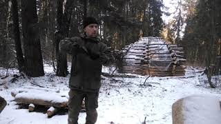 bushcraft. camp in the forest. fire over the ground.