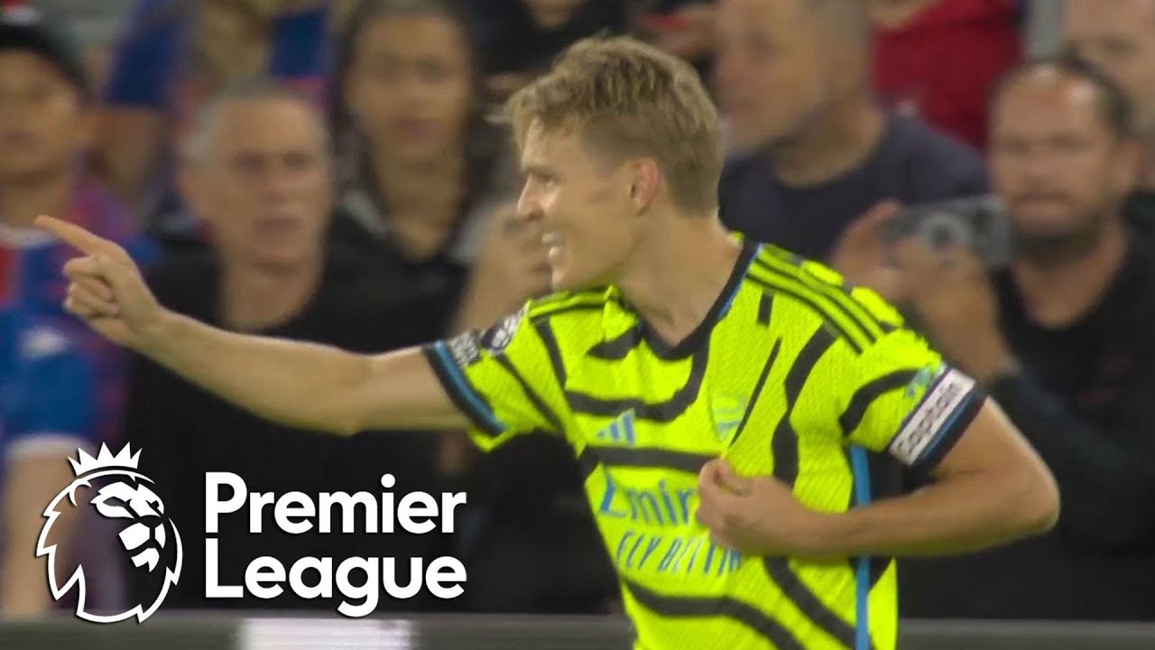 Martin Odegaard's penalty seals a nervy win for 10-man Arsenal