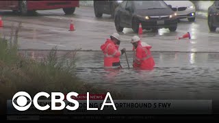 Flooding closes the northbound 5 Freeway in Sun Valley
