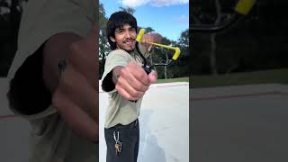 Slingshot target practice with grapes