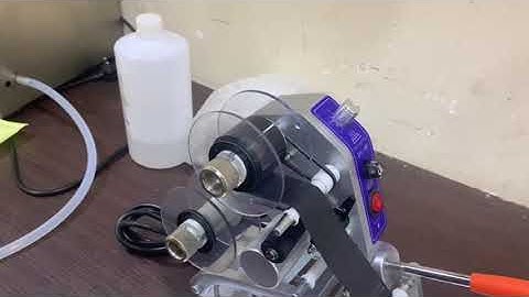 Ribbon changing in a manual coding machine.
