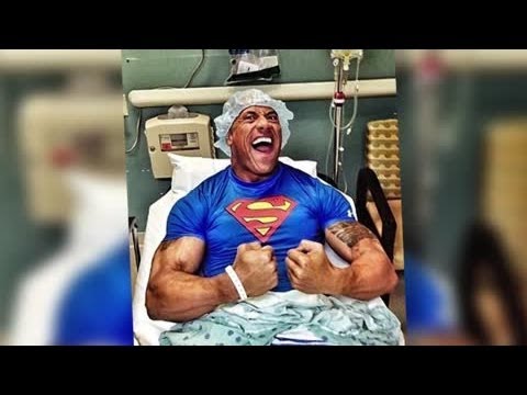 dwayne-johnson-flexes-his-muscles-in-hospital-bed-after-emergency-surgery---splash-news