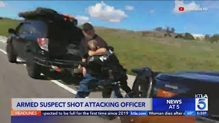 Armed suspect shot attacking officer