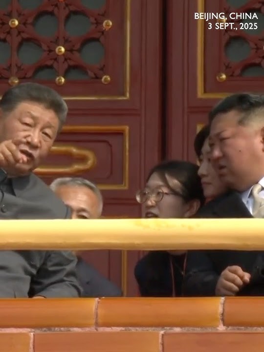 Kim Jong Un asks Xi questions during watching China's V-Day parade
