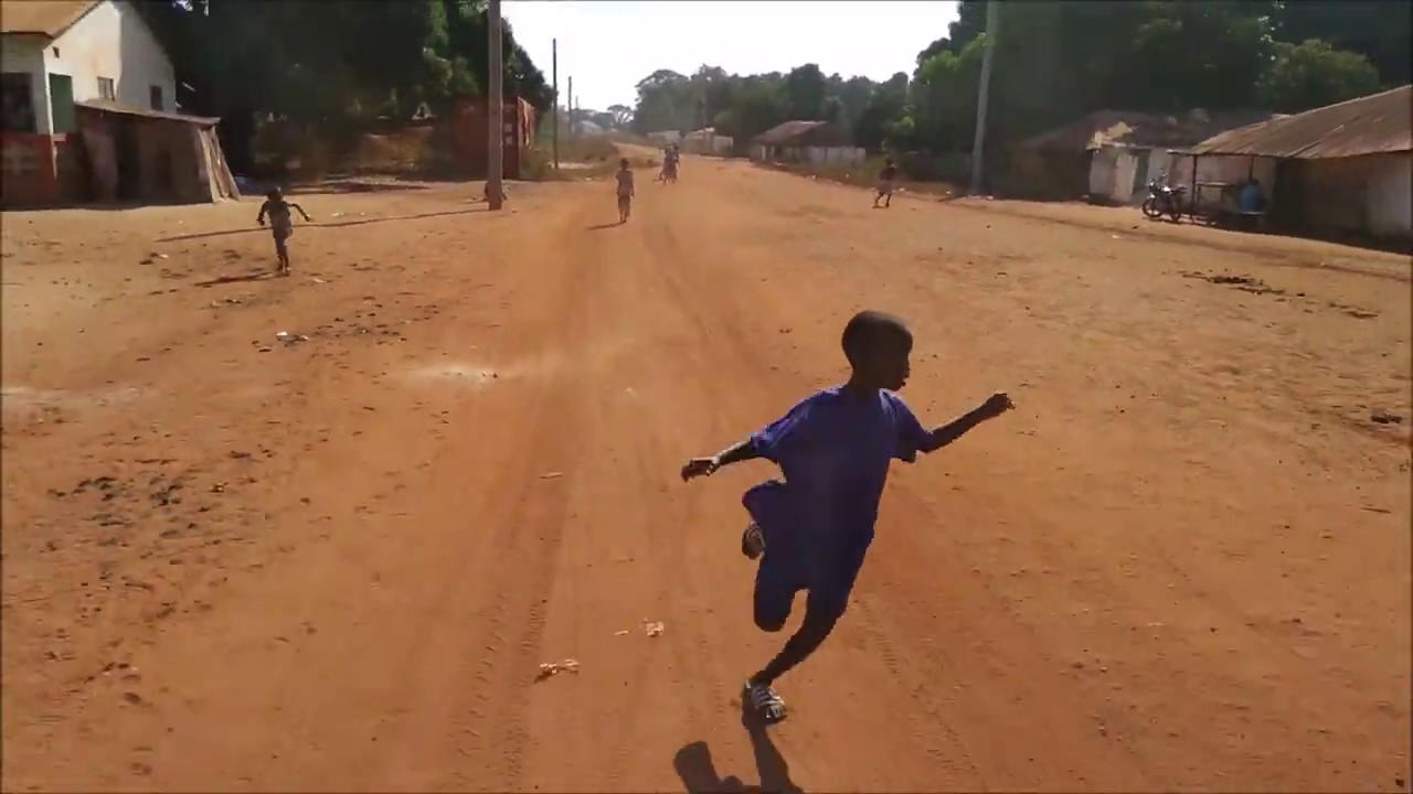 Throwing candy from the car to kids in Senegal. YouTube