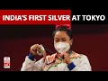 Weightlifter Mirabai Chanu reacts after winning India's first silver at Tokyo Olympics