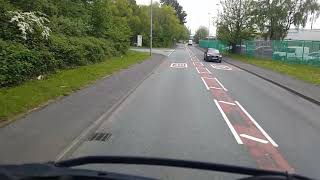 Artic truck rolls over on roundabout driver ok