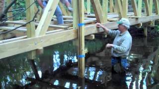 The moment of truth after 5+ months of effort. The 3 temporary supports are removed - will the truss bridge stand or fail?? Watch to ...