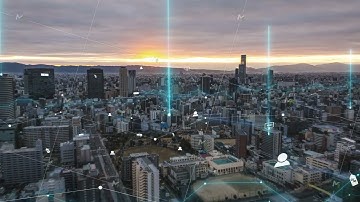 Modern city at sunset with dynamic data visualization overlays, showcasing digital analytics across