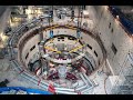 ITER : FIRST RING-SHAPED COIL PRODUCED ON SITE IS POSITIONED IN THE ASSEMBLY PIT