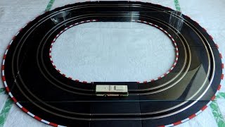 Test of Tomytec N scale Bus System on tracks from Carrera Go with a piece of glass between them