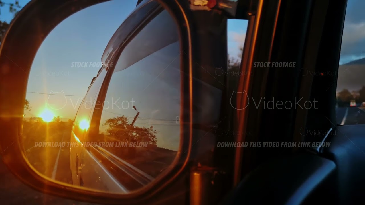 Reflective sunset during scenic drive, Vivid image capturing sunset reflections on road trip