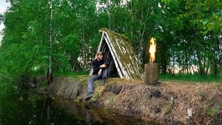 Building a birch logs shelter near the water. Catch and cook. Bushcraft. Swedish torch. Survival