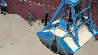 Dry Bulk Cargo Operation: Clamshell Grab &amp; Wheel Loader Working Inside Ship’s Hold 