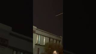 Fireball Meteor Streaks Across Sky Over City
