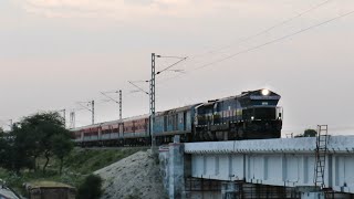 Early Morning High Speed Diesel Train on River Bridge.