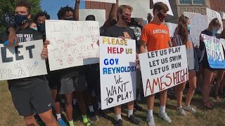 Students march in protest of state's decision to suspend sports and in-person activities