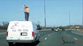 Girl Dancing on top of Moving Van on the Highway