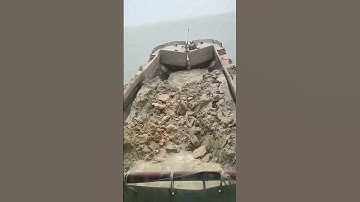 Split Hopper Barge Discharging Sediment at Designated Disposal Site