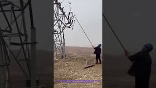 Epic Power Line Maintenance: Using a Long Insulated Pole