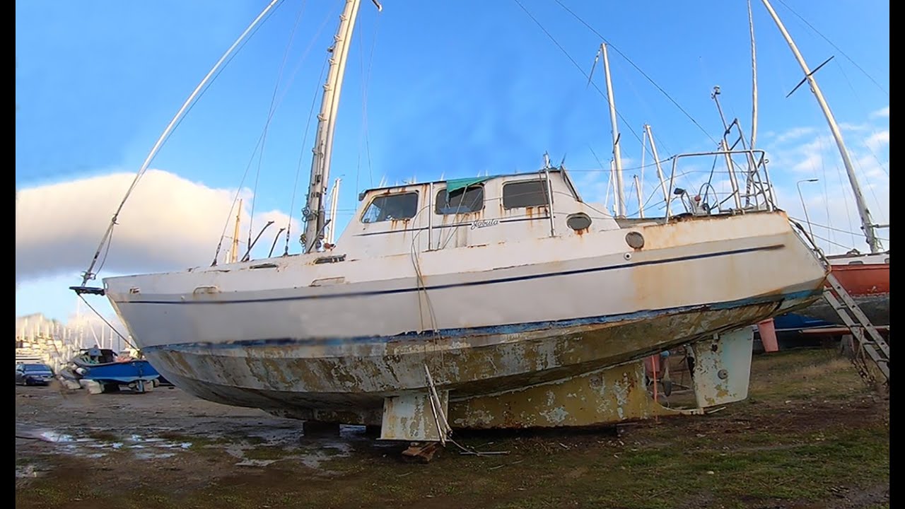 #24 She doesn’t have a wet bottom!  Awkward work on the underside of our steel yacht