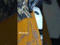 Tippmann Boss stitching a rattlesnake inlay rifle sling.