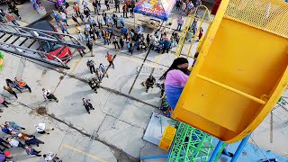 A Little Girl Stuck At The Top Of A Ferris Wheel