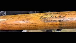 Holding Babe Ruth's bat at the National Sports Collectors Convention