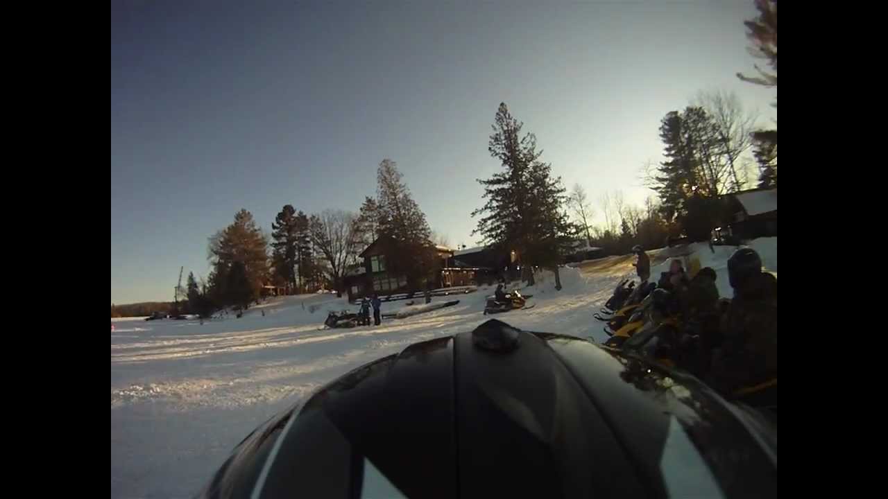 Tic Lodge crew Snowmobiling across Cisco Chain of Lakes