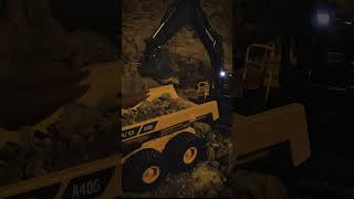 Volvo RC Excavator Digging at Night