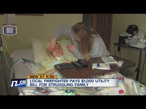 Fire fighter pays $1,000 bill for struggling family